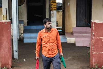 Full length of a man standing in front of building