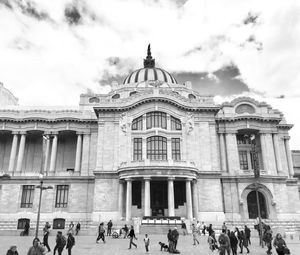 Low angle view of historical building against cloudy sky