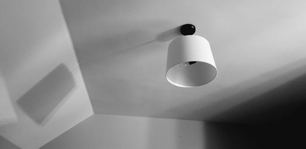 Low angle view of pendant light hanging on ceiling at home