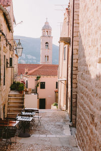 Alley amidst buildings in city