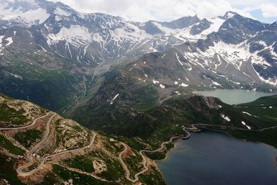 Aerial view of snowcapped mountains against sky