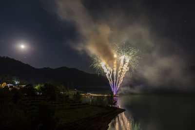 Firework display at night