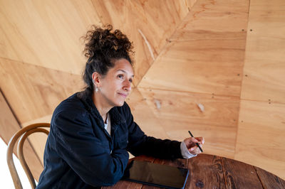 Woman using a digital tablet with an electronic pen.