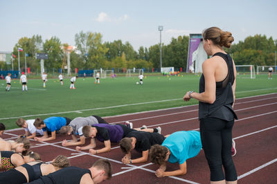 People exercising on field