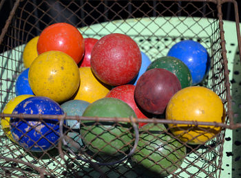 Close-up of multi colored eggs in basket