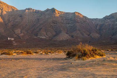 Scenic view of desert against clear sky