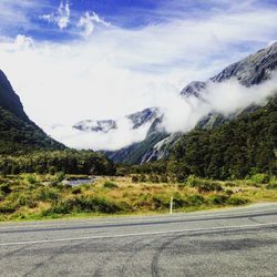 Country road with mountains in background