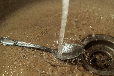 Close-up of water drops on metal