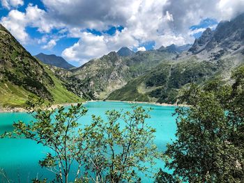 Scenic view of lake and mountains against sky