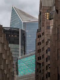 Low angle view of modern buildings against sky