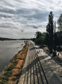 View of empty road against cloudy sky