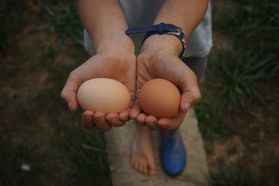 Midsection of man holding ice cream