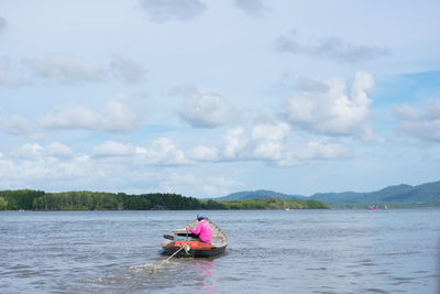 Fisherman fishing in river