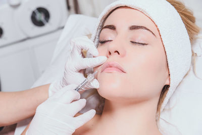 Cropped image of surgeon doing anti aging therapy