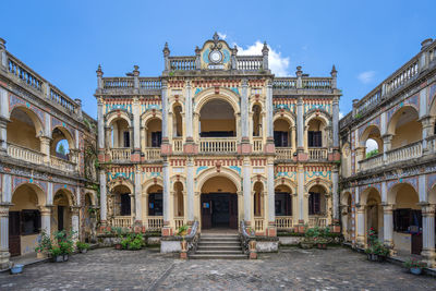 Facade of historic building against sky