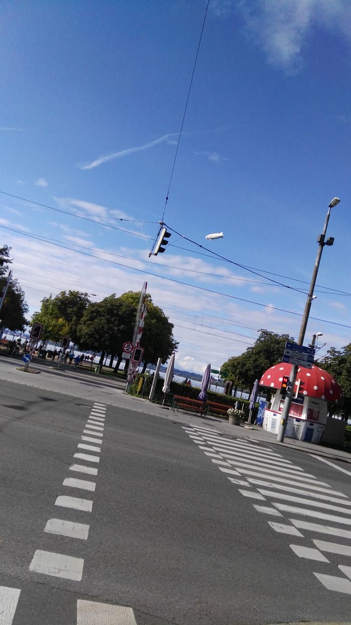 transportation, road, car, street, sky, cable, day, tree, outdoors, land vehicle, mode of transport, the way forward, no people, nature