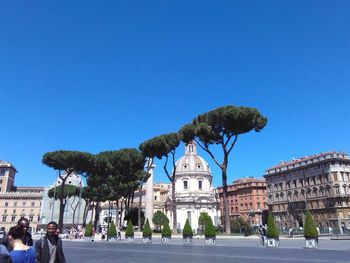 View of buildings against clear blue sky