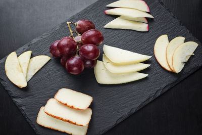 High angle view of fruits in plate on table