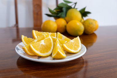 Close-up of fruits in plate on table