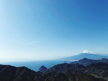 Scenic view of mountains against clear blue sky