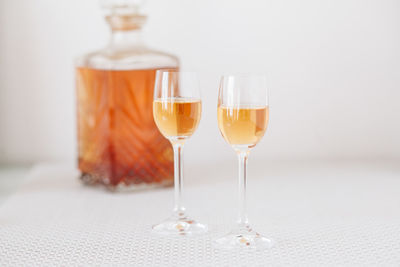 Close-up of wine glasses on table