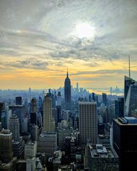 Aerial view of city buildings during sunset