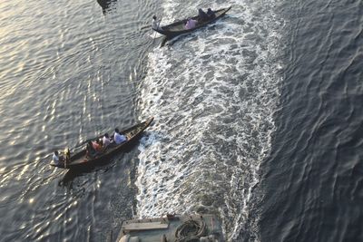 High angle view of people on sea