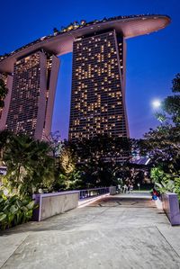 Low angle view of illuminated building against sky at night