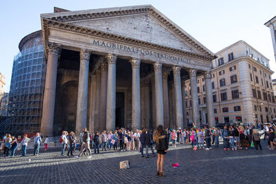 Group of people in front of historical building