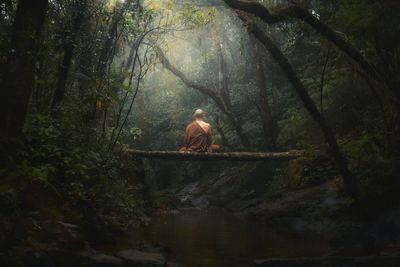 Man sitting in a forest