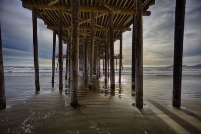 Pier on sea against sky