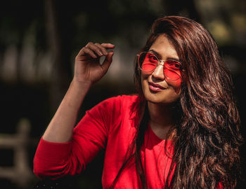 Portrait of young woman wearing sunglasses