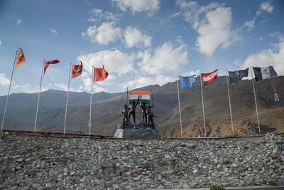 Flag on field against sky