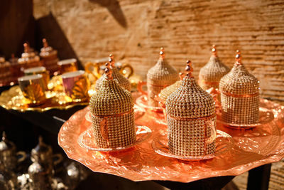 Handicraft beaded decorate arabic style tea cups. brass colored traditional middle-eastern tea set