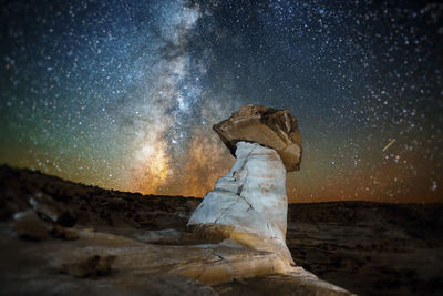 Statue against sky at night