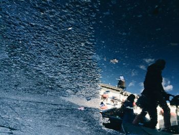 Reflection of people in water