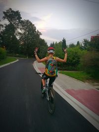 Man riding bicycle on road