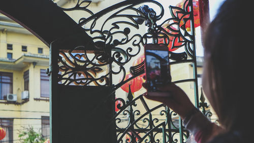 Close-up of woman holding camera