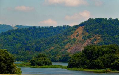 Scenic view of lake with mountains in background