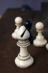 Close-up of chess pieces on table