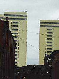 Buildings in city against sky