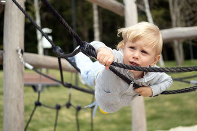 Portrait of boy playing with rope