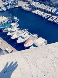 High angle view of boats moored at harbor