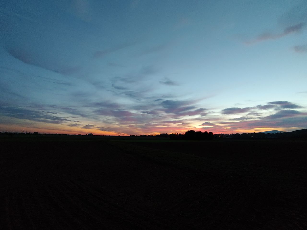 sky, sunset, beauty in nature, tranquil scene, scenics - nature, tranquility, environment, cloud - sky, landscape, silhouette, nature, no people, land, non-urban scene, field, orange color, outdoors, horizon, idyllic, dusk