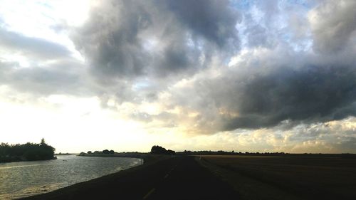 View of road against cloudy sky