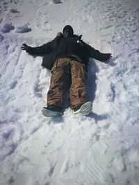 Man standing on snow covered field