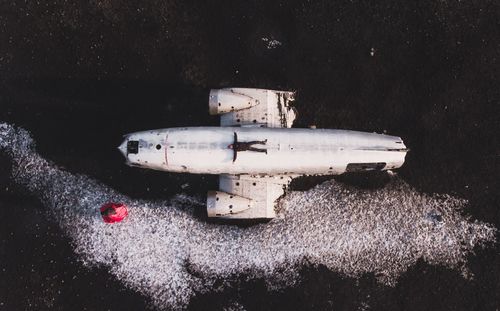 Man lying on abandoned plane