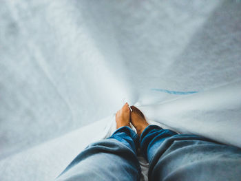 Low section of man wearing shoes