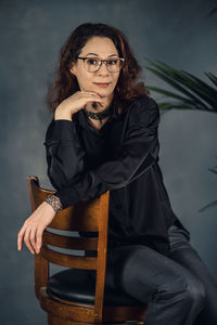 Middle age business woman posing for content in studio