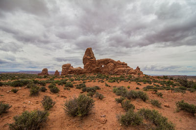 Rock formations on landscape against sky